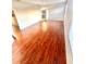 Bright bedroom with light walls and wood flooring, enhanced by natural light from large windows at 7423 Pulteney Dr, Zephyrhills, FL 33545
