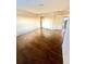 Bedroom featuring hardwood flooring, neutral walls, and a closet for convenient storage at 7423 Pulteney Dr, Zephyrhills, FL 33545