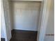 Standard closet with wire shelving and dark brown flooring at 7423 Pulteney Dr, Zephyrhills, FL 33545
