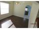 Dining room with hardwood floors and view to kitchen at 7423 Pulteney Dr, Zephyrhills, FL 33545