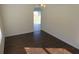 Dining room with hardwood floors and view to the backyard at 7423 Pulteney Dr, Zephyrhills, FL 33545