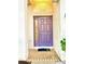 Stylish purple front door that complements the home's exterior, adding a touch of elegance at 7423 Pulteney Dr, Zephyrhills, FL 33545