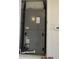Utility closet with HVAC unit and thermostat at 7423 Pulteney Dr, Zephyrhills, FL 33545
