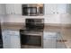 Sleek stainless steel appliances and granite countertops highlight this kitchen at 7423 Pulteney Dr, Zephyrhills, FL 33545