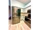 Modern kitchen with stainless steel appliances and custom cabinets, perfect for cooking and entertaining at 7423 Pulteney Dr, Zephyrhills, FL 33545