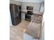 Stainless steel appliances and granite countertops in this updated kitchen at 7423 Pulteney Dr, Zephyrhills, FL 33545