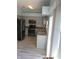 Well-lit kitchen featuring stainless steel appliances, light-colored cabinets, and granite countertops at 7423 Pulteney Dr, Zephyrhills, FL 33545