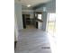 Modern kitchen with stainless steel appliances and light blue cabinets at 7423 Pulteney Dr, Zephyrhills, FL 33545