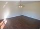 Spacious living room with hardwood floors and ceiling fan at 7423 Pulteney Dr, Zephyrhills, FL 33545