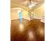 Open-concept living room with hardwood floors and abundant natural light, great for entertaining at 7423 Pulteney Dr, Zephyrhills, FL 33545