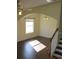 Bright living room with hardwood floors and lots of natural light at 7423 Pulteney Dr, Zephyrhills, FL 33545
