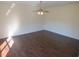 Spacious living area with hardwood flooring, ceiling fan, and recessed lighting at 7423 Pulteney Dr, Zephyrhills, FL 33545