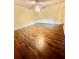 Spacious living room with hardwood floors and neutral tones, creating a warm and inviting space at 7423 Pulteney Dr, Zephyrhills, FL 33545