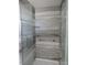 Modern shower with glass enclosure and gray tile at 7423 Pulteney Dr, Zephyrhills, FL 33545