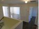 Upstairs hallway with doors to bedrooms and a large storage closet at 7423 Pulteney Dr, Zephyrhills, FL 33545