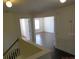 View of an upstairs hallway with access to bedrooms and a storage closet at 7423 Pulteney Dr, Zephyrhills, FL 33545