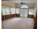 Bright living area with large windows, tiled flooring, and partial wall framework at 988 Bruce Ave, Clearwater Beach, FL 33767