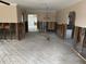Open-concept living room showcasing hardwood floors and a versatile layout for personalized design at 988 Bruce Ave, Clearwater Beach, FL 33767