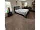 Comfortable bedroom with a cozy bed, natural light, and functional furnishings at 10319 Boyette Creek Blvd, Riverview, FL 33569