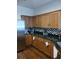 Modern kitchen with wood cabinets, granite countertops and stainless steel appliances at 10319 Boyette Creek Blvd, Riverview, FL 33569