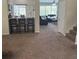 An open-concept living area featuring bar seating, a spacious layout, and outdoor views at 10319 Boyette Creek Blvd, Riverview, FL 33569