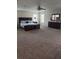 Spacious main bedroom featuring a large bed, windows, and ample closet space at 10319 Boyette Creek Blvd, Riverview, FL 33569
