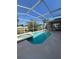 This screened-in pool has an attached jacuzzi and ample seating for relaxing in the sun at 10319 Boyette Creek Blvd, Riverview, FL 33569