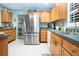 Spacious kitchen with stainless steel refrigerator and plenty of storage at 112 Silverbell Ct, Sun City Center, FL 33573