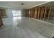 Spacious living room with tiled flooring and ample natural light, ready for finishing touches at 11300 7Th E St, Treasure Island, FL 33706