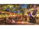 Outdoor dining area in a city setting at night at 11300 7Th E St, Treasure Island, FL 33706