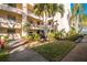 Building exterior showcasing landscaping and walkway at 11485 Oakhurst Rd # A203, Largo, FL 33774