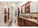 Elegant bathroom with double sinks and granite countertops at 12518 Midpointe Dr, Riverview, FL 33578