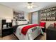 Bright bedroom with a comfy queen-size bed and stylish decor at 12518 Midpointe Dr, Riverview, FL 33578