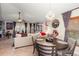 Charming dining area with round table and modern chandelier at 12518 Midpointe Dr, Riverview, FL 33578