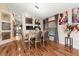 Bright dining room features elegant chandelier and hardwood floors at 12518 Midpointe Dr, Riverview, FL 33578
