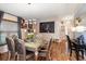 Spacious dining area with hardwood floors and large artwork at 12518 Midpointe Dr, Riverview, FL 33578
