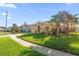 Single-story home with lush lawn and palm trees at 12518 Midpointe Dr, Riverview, FL 33578