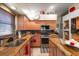 Updated kitchen featuring granite countertops and ample cabinet space at 12518 Midpointe Dr, Riverview, FL 33578
