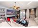 Open living room featuring a large sectional sofa and access to a patio at 12518 Midpointe Dr, Riverview, FL 33578