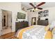 Spacious main bedroom with a large bed and en-suite bathroom at 12518 Midpointe Dr, Riverview, FL 33578