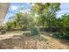 Large backyard with mature trees and grassy area at 1316 S Evergreen Ave, Clearwater, FL 33756