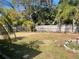 Large, fenced backyard with plenty of space for outdoor activities at 137 Sw Lincoln N Cir, St Petersburg, FL 33703