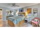 Bedroom with a queen-size bed, ceiling fan and walk-in closet at 1406 Butch Cassidy Trl, Wimauma, FL 33598