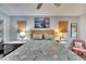 Bedroom with a queen-size bed, ceiling fan, and plenty of natural light at 1406 Butch Cassidy Trl, Wimauma, FL 33598