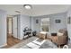 Bedroom with light-blue walls, wood floors, and a daybed at 1406 Butch Cassidy Trl, Wimauma, FL 33598