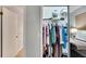 Walk-in closet with ample hanging space and shelving at 1406 Butch Cassidy Trl, Wimauma, FL 33598