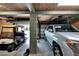 Two-car garage with golf cart and extra storage space at 1406 Butch Cassidy Trl, Wimauma, FL 33598