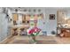 Well-equipped kitchen with light wood cabinets and granite countertops at 1406 Butch Cassidy Trl, Wimauma, FL 33598