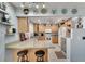 Fully equipped kitchen with ample counter space and light wood cabinets at 1406 Butch Cassidy Trl, Wimauma, FL 33598