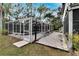 Screened pool and deck with backyard access at 1406 Butch Cassidy Trl, Wimauma, FL 33598